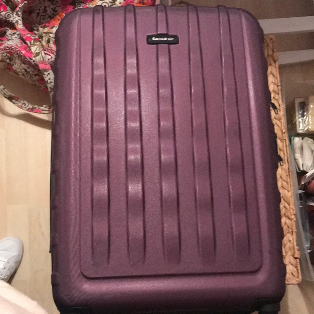 Purple large check luggage like new. Got new luggage.